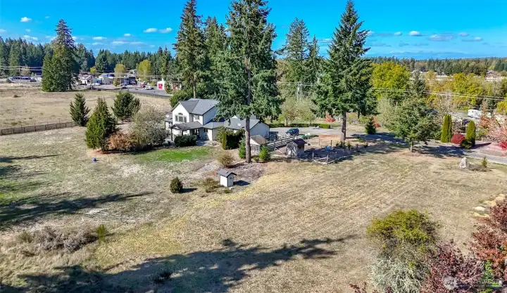 This view is southeast of the home and faces 340th St E. This saide yard is larger than it appears in this picture. Room here to grow...