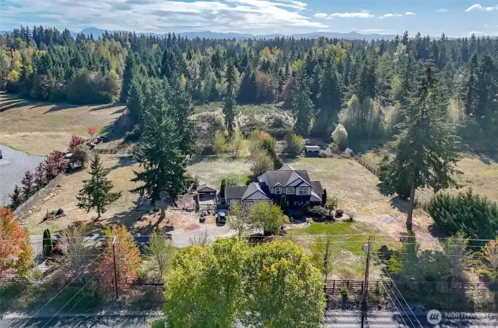 If you use the trees to the left property line and the fence line on the right that is a rough estimate of side of the property (buyer to verify) The acreage goes back south of the house.