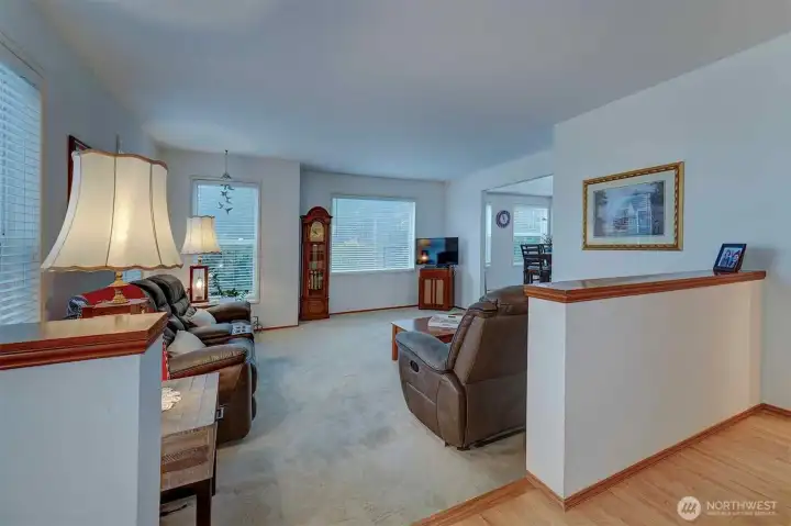 Spacious living room with lots of natural light, room for relaxing and entertaining.