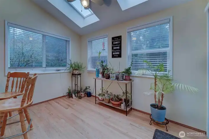 Sunroom--- what would you do here?  Seller has her office upstairs but maybe you'd put yours here! All that natural light and high ceilings may make you more creative if that's your kind of work.