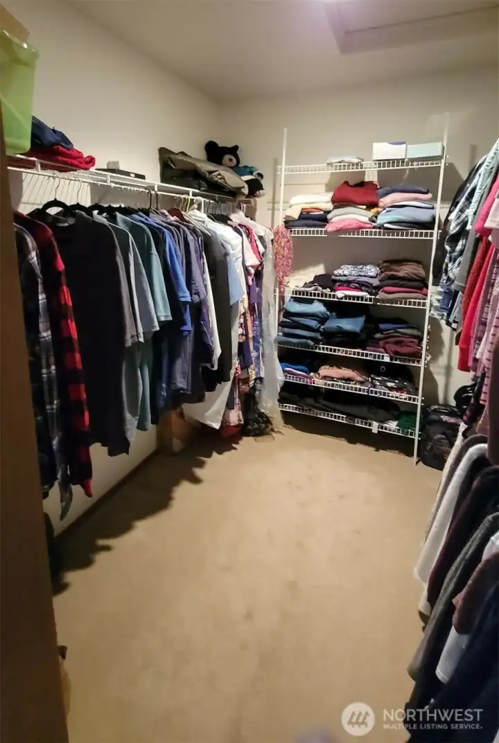 Primary walk in closet Primary walk in closet