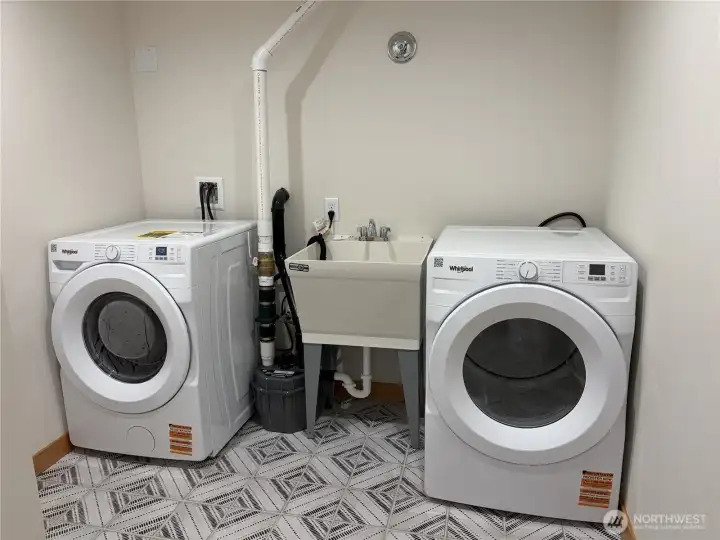 Large laundry room with utility sink. Washer/dryer included!