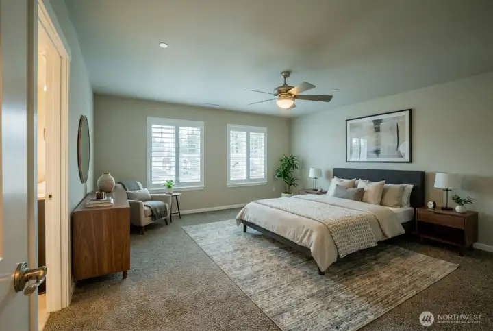 Upstairs, the primary suite has a sunny view and lots of room.