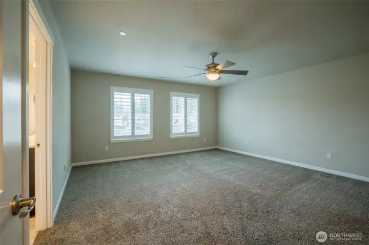 Custom louvered window shutters are excellent at blocking out the light for good sleep.