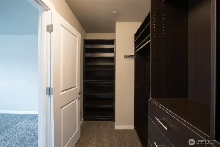 ...featuring space for lots of hanging clothes and built-in dressers too.