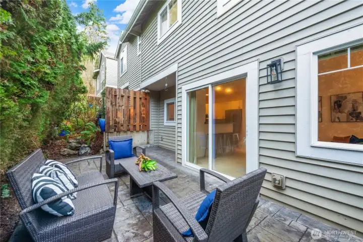 Large stamped concrete patio with easy access to kitchen