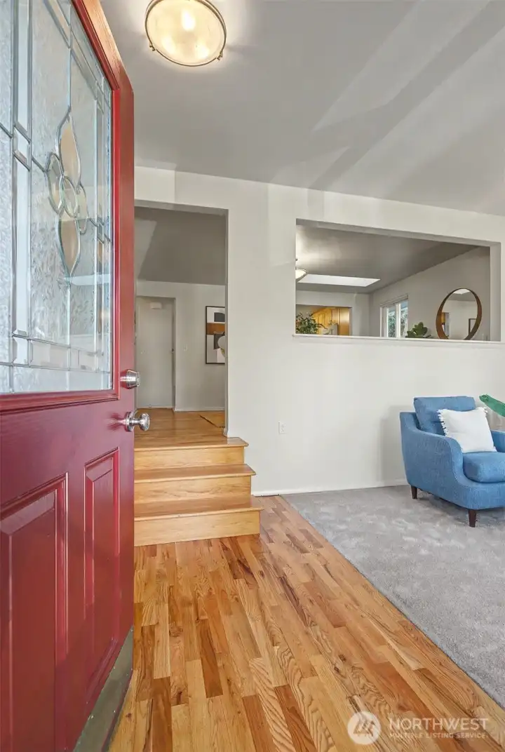 Welcome in!  To the right is the living room and up the stairs is the dining room.