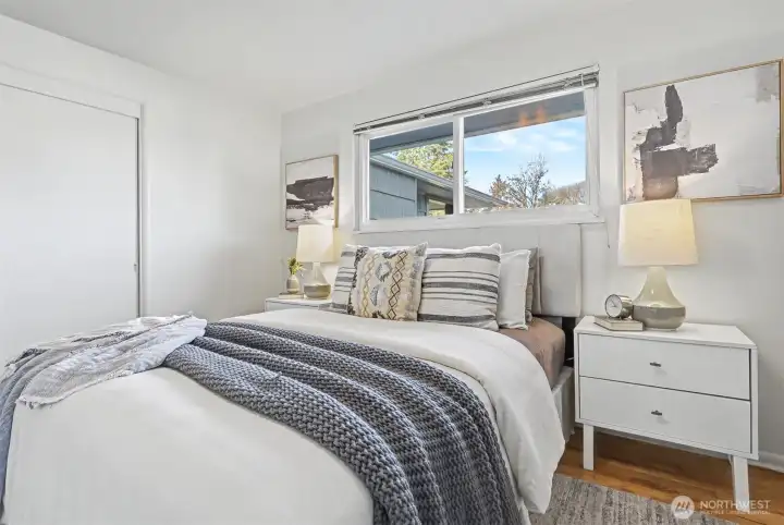 Bedroom one has fresh paint and newly refinished hardwood floors.
