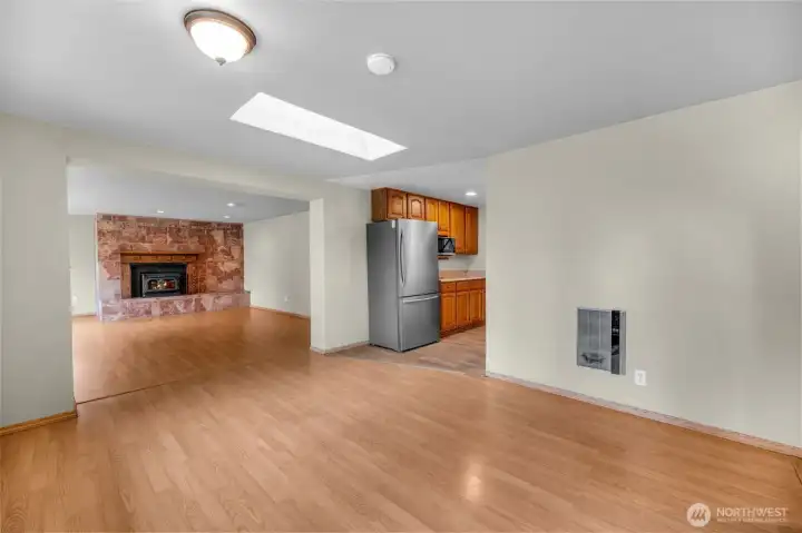 Looking from entry way into the family area and kitchen
