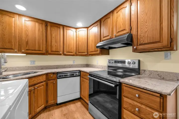 Kitchen with plenty of cabinets and lighting.