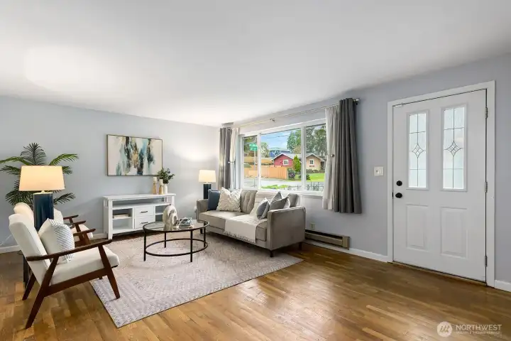 The living room is large with ample room for big furniture and even an L-shaped couch.