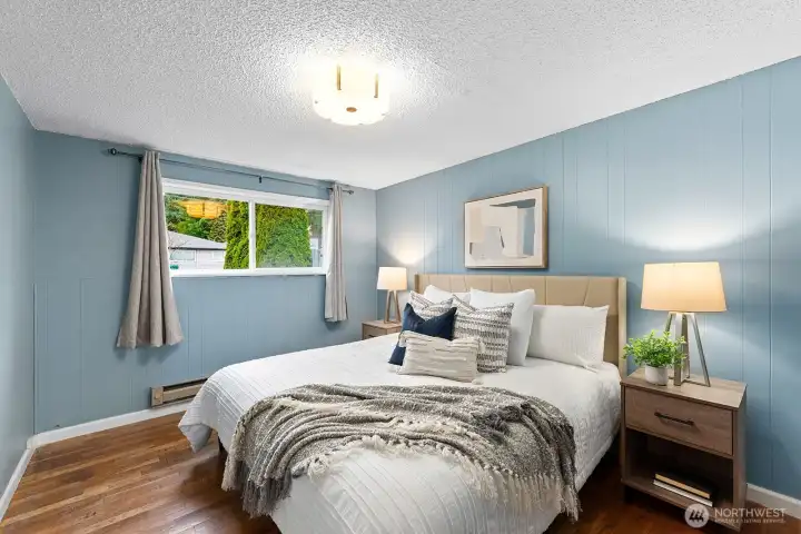 This bedroom fits a King sized bed nicely.