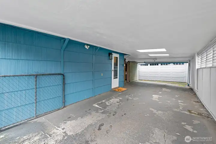 Beyond the carport is a huge 2 car garage.