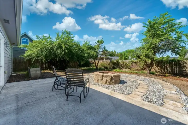 Fenced backyard w/ established plantings