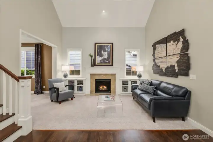 Soaring ceilings continue into the elegant living room.