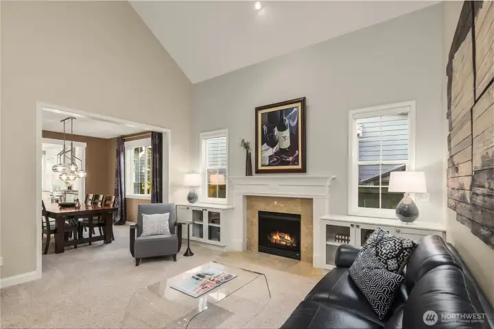 Custom built-ins flank the living room fireplace.