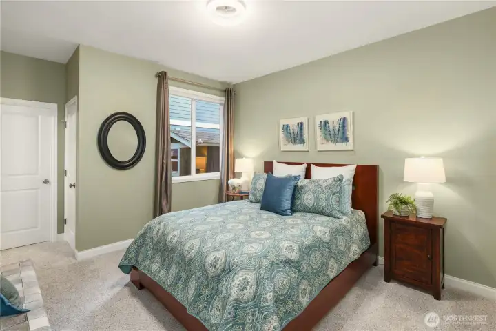 Main-floor bedroom suite with walk-in closet...ideal for guests or multi-generational living.