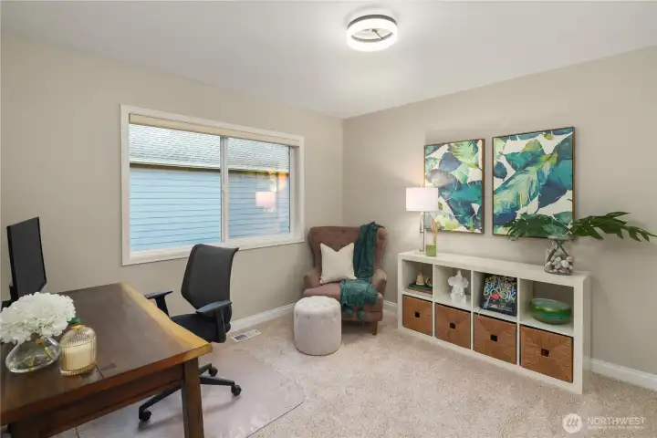 The third upstairs bedroom, currently being used as an office.