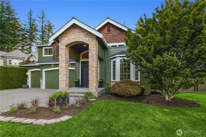 Beautifully maintained landscaping welcomes you home.