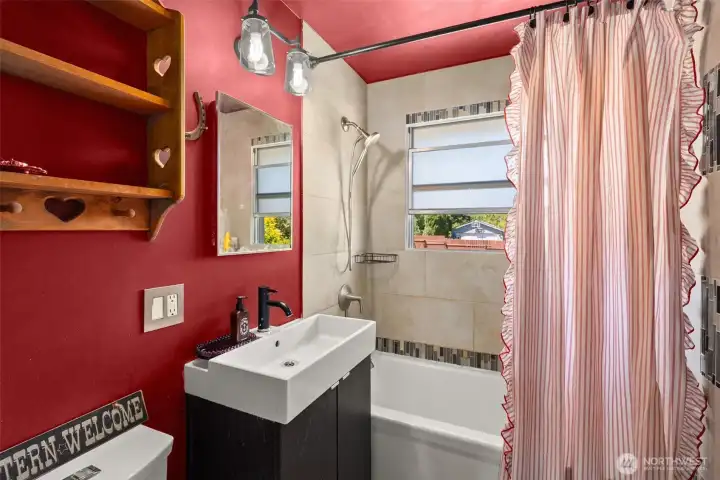 bathroom with bathtub and shower and heated flooring