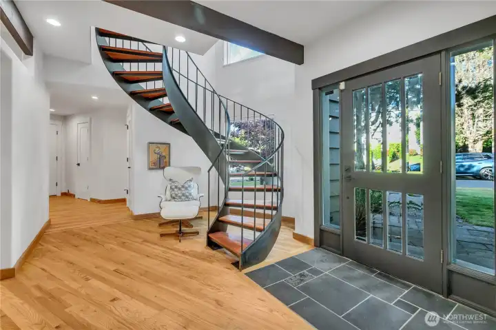 Foyer with Spiral Staircase to Primary Foyer with Spiral Staircase to Primary