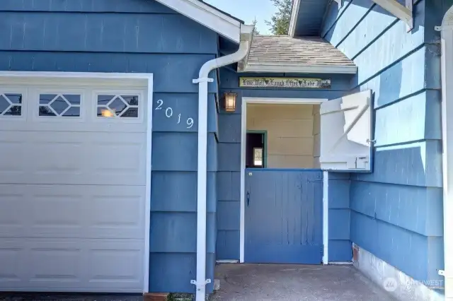 Enter through the dutch door to the enclosed breezeway and patio.