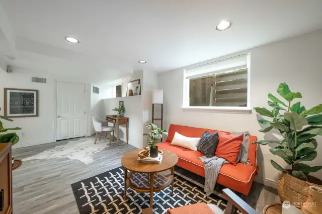 Living room in basement is ideal for a media room or guest suite.