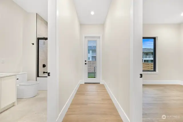 Hallway from back of the home leading to the two bedrooms.