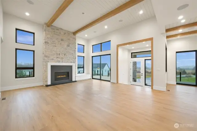 Open concept living room with 14' custom ceilings.