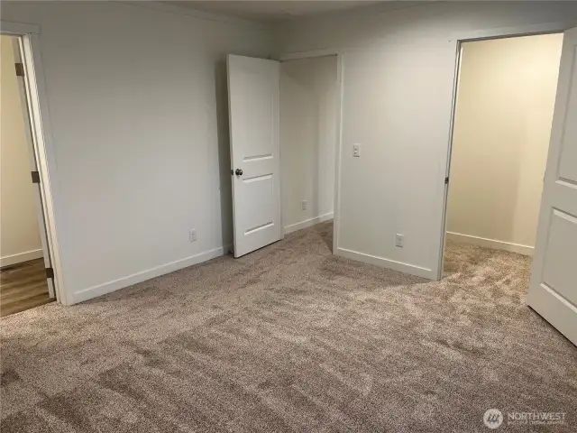 Primary bedroom looking at walk in closet.