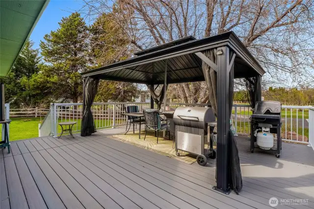 Outside, enjoy lush landscaping, fruit trees, and a garden