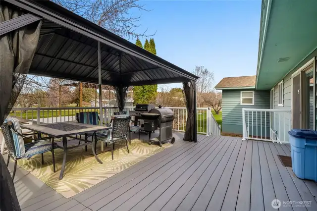 The covered back deck is perfect for entertaining