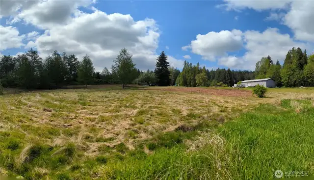 View looking Southeast towards neighbors shop