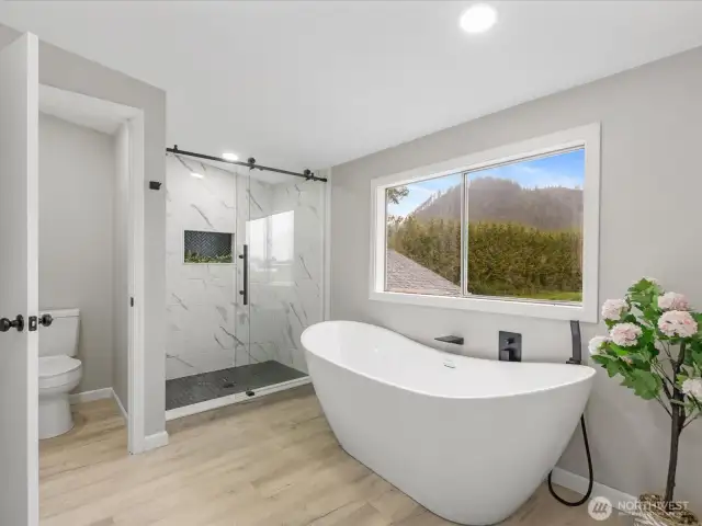 primary bath with luxury soaker tub & gorgeous fully tiled shower