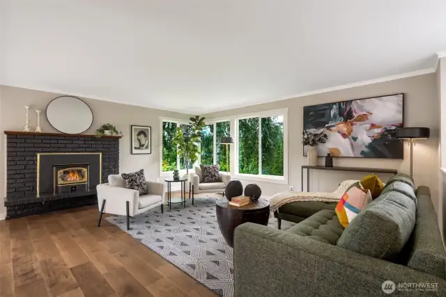 Inviting living room with wood burning fireplace.