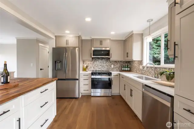 Ample custom built cabinets & plenty of counter space to create your next masterpiece- or just a really good hot dog.