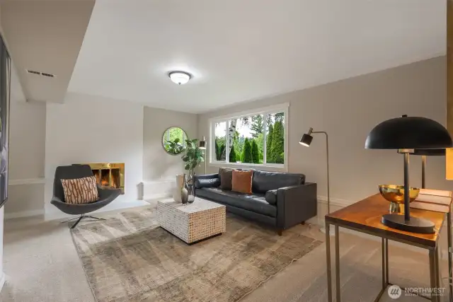 Sneak away to the lower lever family room with new carpet and a cozy wood buring fireplace.