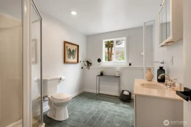 The lower level 3/4 bath offers a large laundry space