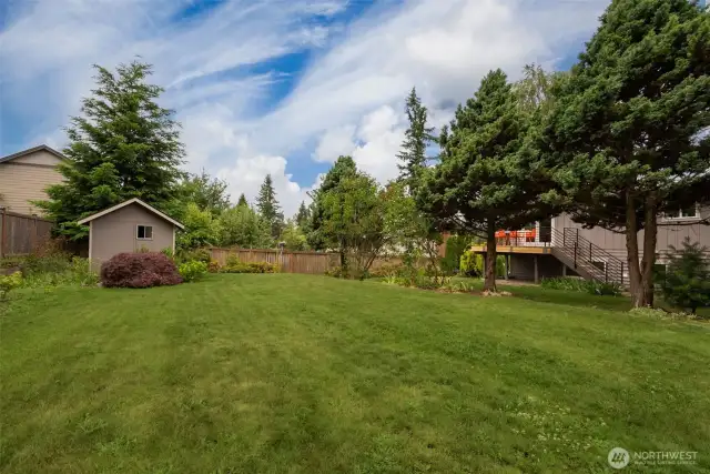 The tool shed is located in the back of the lot.