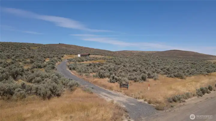 Entrance to the private driveway to property.