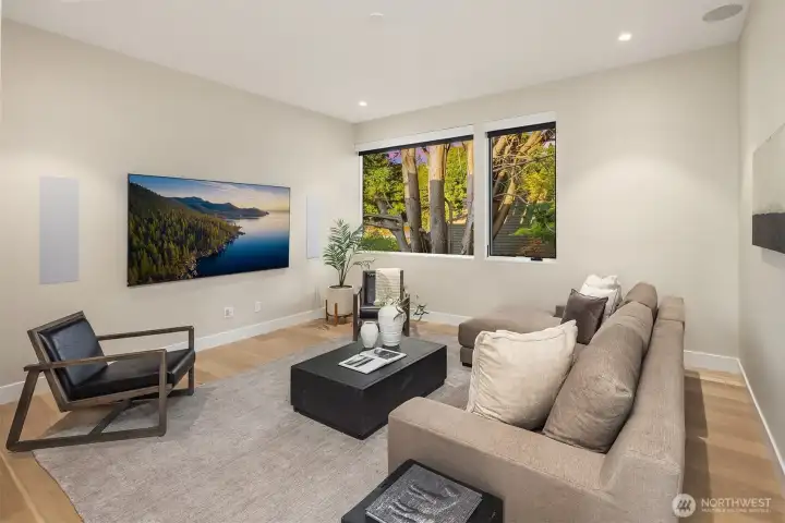 Media room system boasting an 85” Samsung 4K QLED television and Sonos surround sound system
