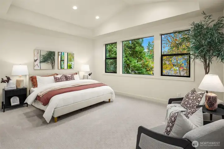 Designer primary suite with five-piece bath with heated floors