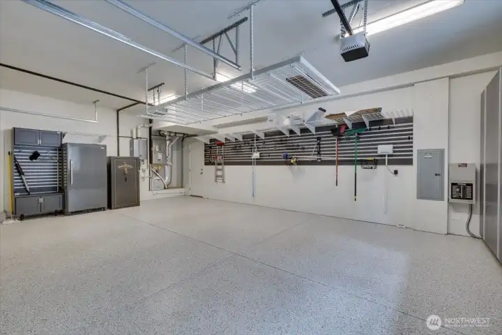 3 car garage, epoxy floors, built in storage