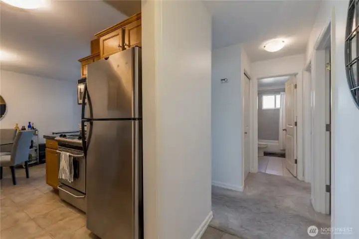 A bright and inviting entry hall separates the private sleeping quarters from the open-concept living spaces.