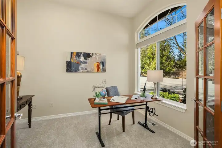 Just off the entry, a private home office with French doors and 240V outlets is ready for whatever you bring to it.    Just off the entry, a private home office with French doors and 240V outlets is ready for whatever you bring to it.