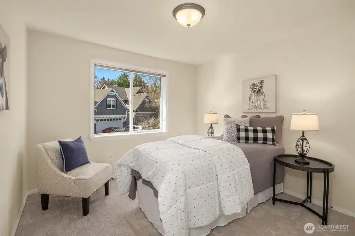 Another of the four upper-level bedrooms — bright, comfortable, and move-in ready.