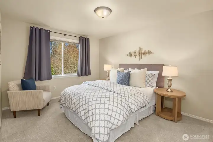 The fourth upper-level bedroom impresses with a spacious walk-in closet.