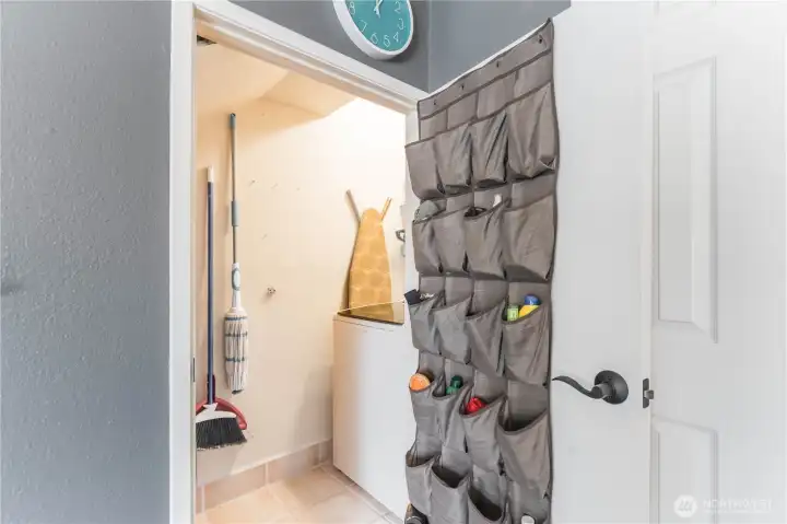 Laundry/ utility closet under stairs on main floor. Laundry/ utility closet under stairs on main floor.