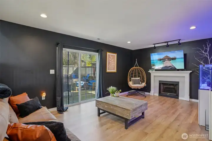 Lower level family/living room with entrance to outside patio