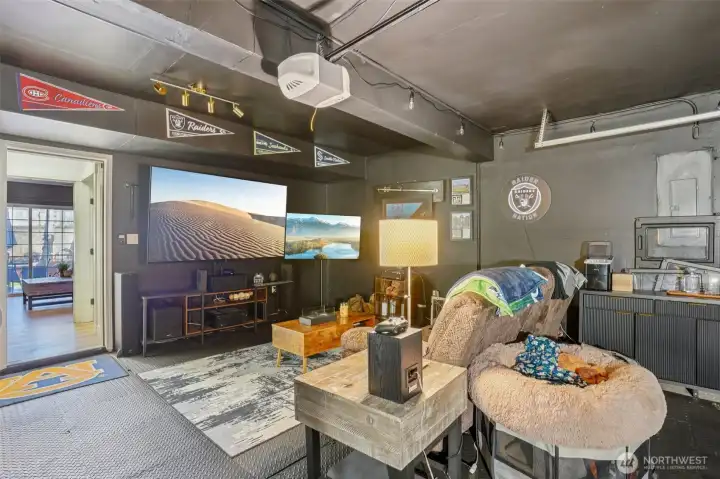 2-car garage currently styled as a bonus hangout space, perfect for hobbies, game day, or extra storage.